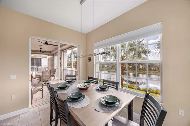 a dining room with furniture and a kitchen view