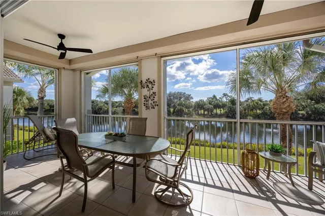 a view of a balcony with chair and wooden floor