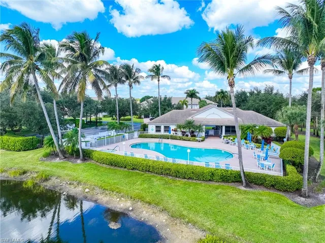 a front view of building with yard and green space