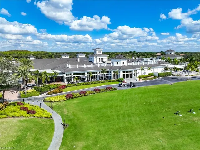 an aerial view of a pool and an outdoor seating