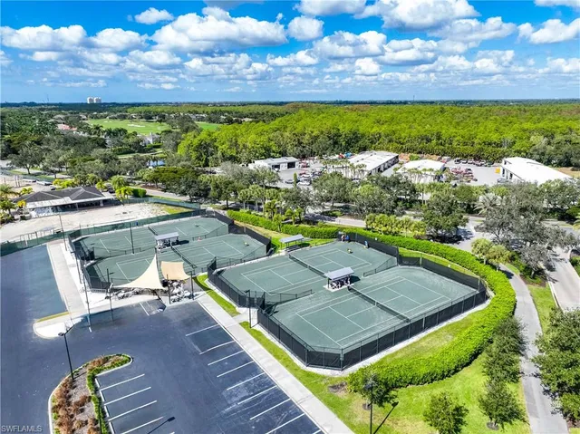 a living room with lots of furniture and a chandelier