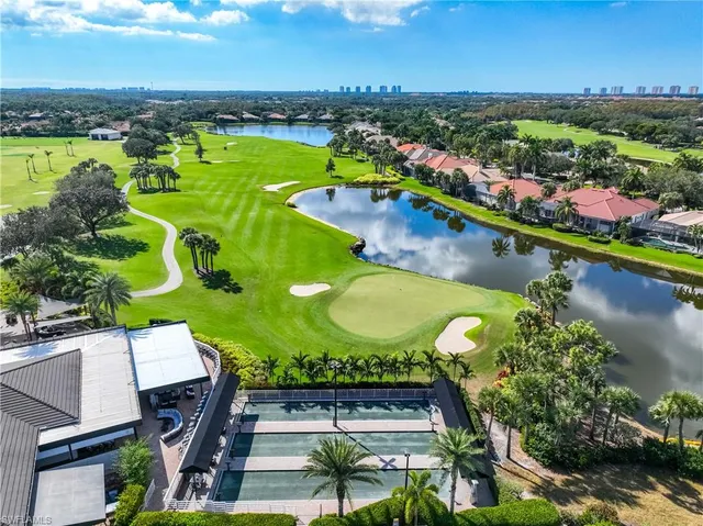 an aerial view of a house with garden space and houses