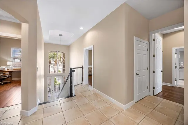 a spacious bathroom with a sink and a mirror