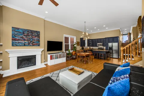 a living room with furniture flat screen tv and a fireplace