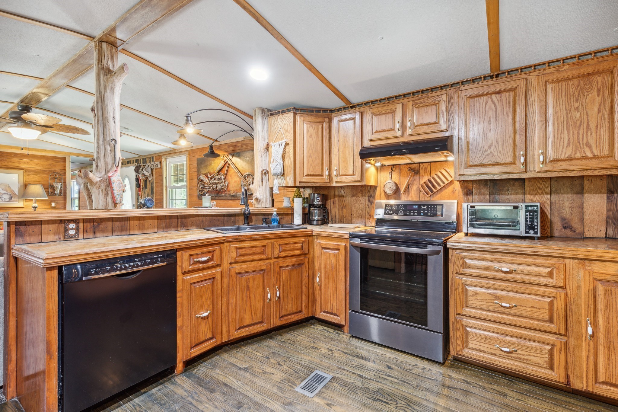 3611 Cooper Nicholson Road Pleasant View, TN 37146 - Photo 25 of 60 a kitchen with stainless steel appliances granite countertop a stove and a sink