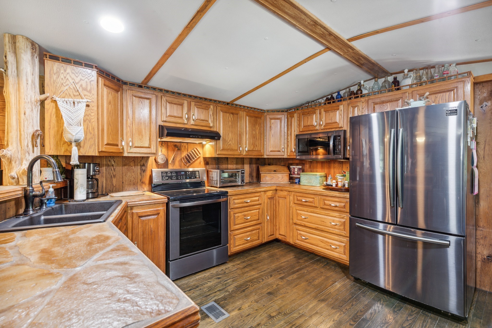 3611 Cooper Nicholson Road Pleasant View, TN 37146 - Photo 26 of 60 a kitchen with stainless steel appliances granite countertop a refrigerator a stove top oven a sink and dishwasher