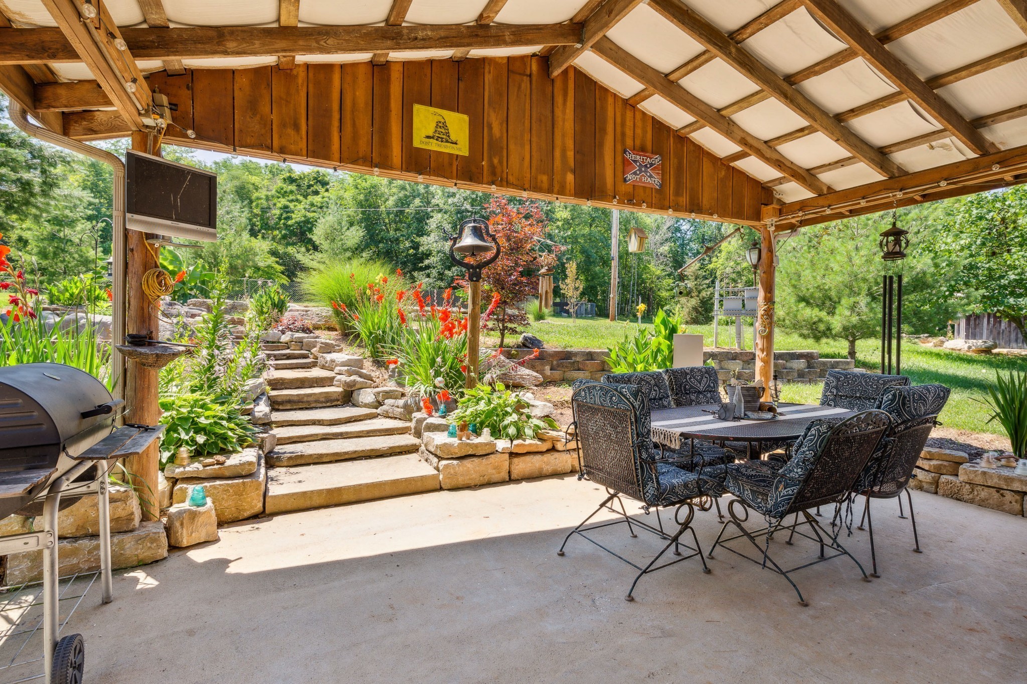 3611 Cooper Nicholson Road Pleasant View, TN 37146 - Photo 59 of 60 a view of a patio with a table and chairs next to a yard