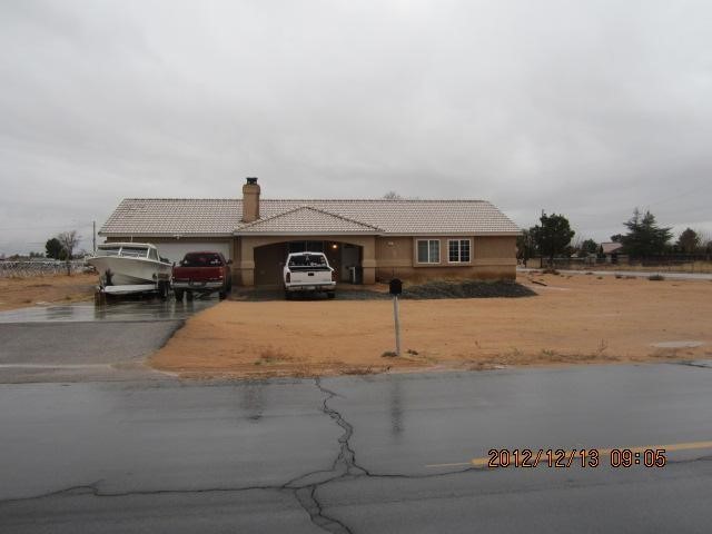 21287 Rancherias Road Apple Valley, CA 92307 - Photo 1 of 1 a car parked on the side of the road