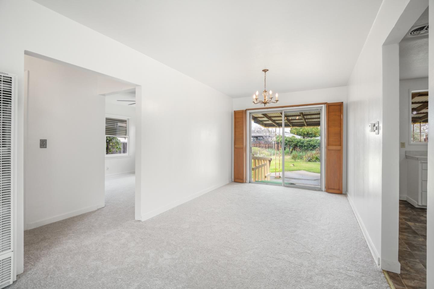 3961 Golf Drive San Jose, CA 95127 - Photo 5 of 14 an empty room with windows and garden