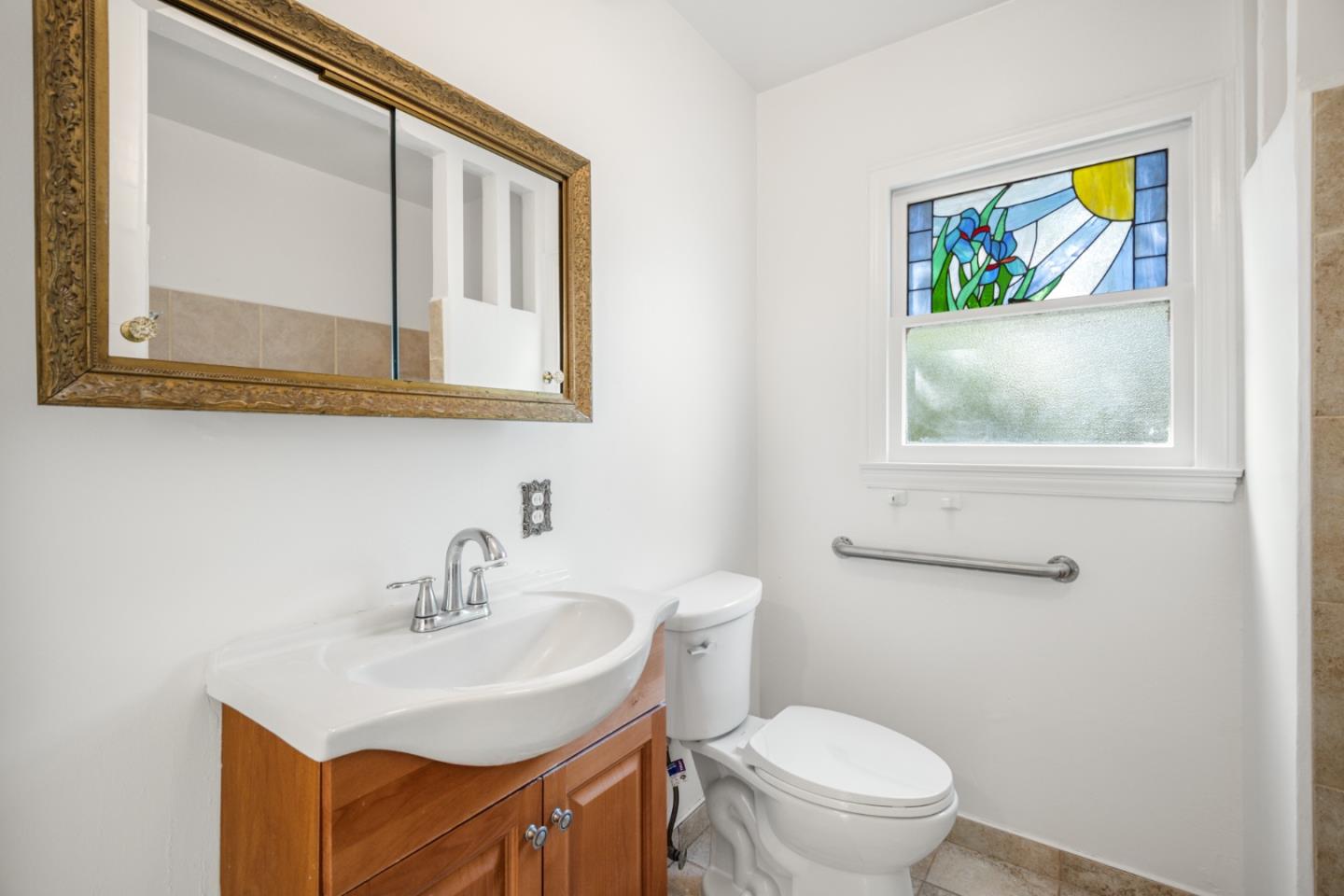 3961 Golf Drive San Jose, CA 95127 - Photo 8 of 14 a bathroom with a toilet a sink and mirror