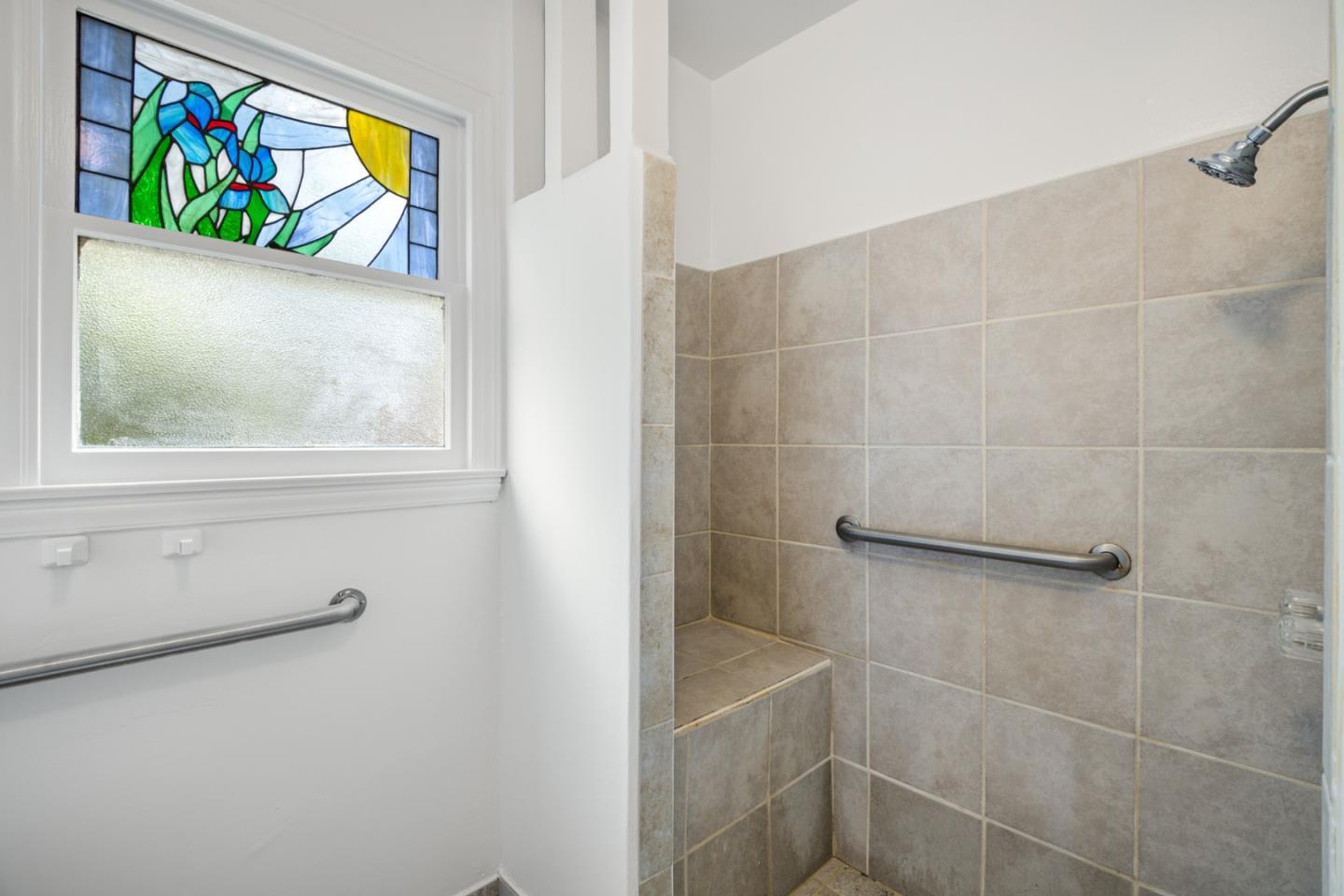 3961 Golf Drive San Jose, CA 95127 - Photo 9 of 14 a bathroom with a painting on the wall and a window
