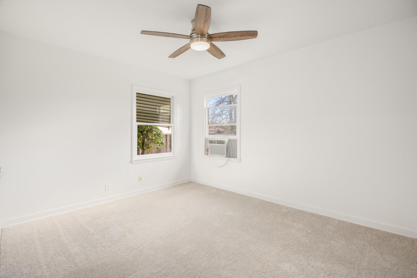 3961 Golf Drive San Jose, CA 95127 - Photo 10 of 14 an empty room with a window and a fan