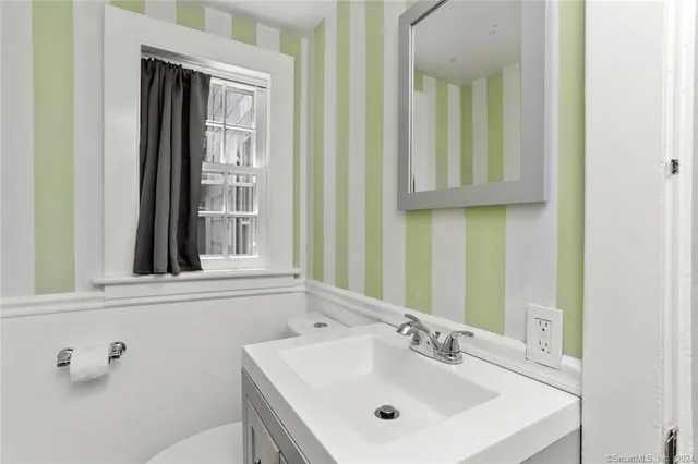 a workspace with furniture pool table and a window