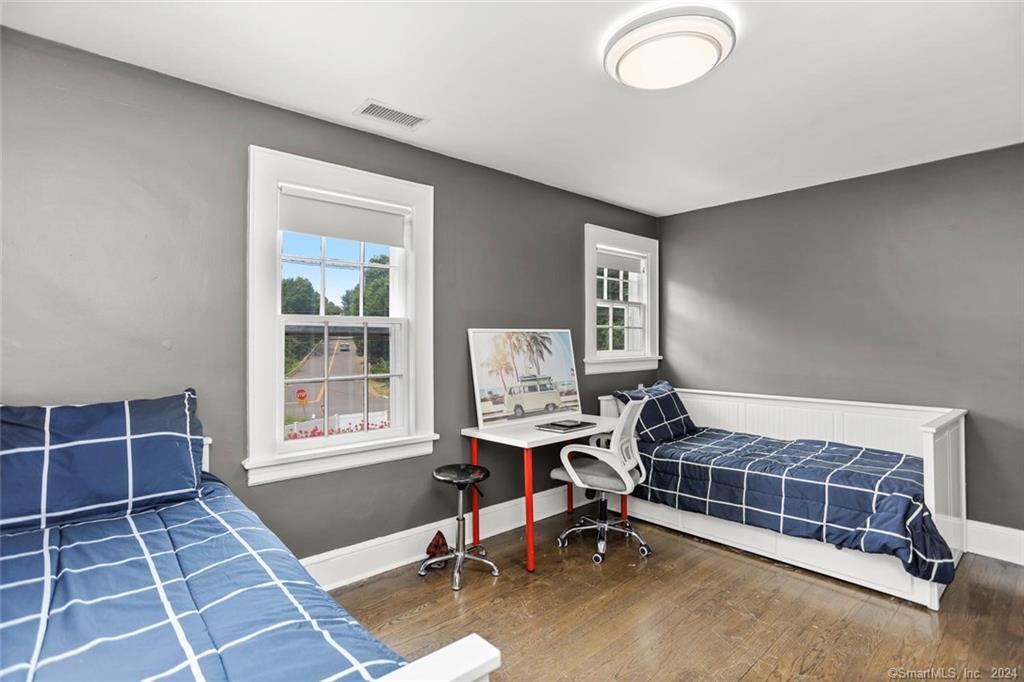 61 Hillandale Road Westport, CT 06880 - Photo 20 of 40 a bedroom with furniture and a window