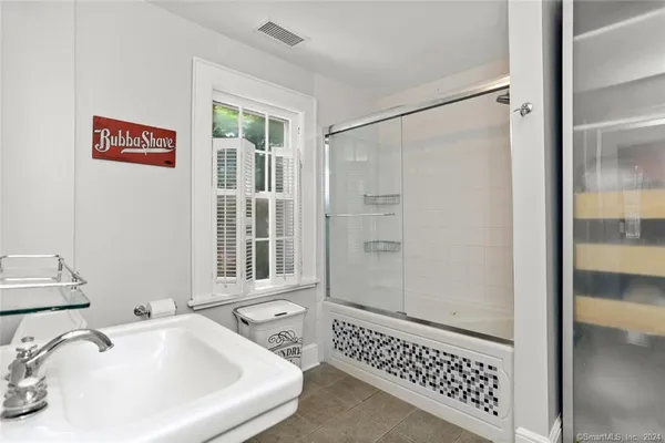 a bathroom with a sink and a toilet