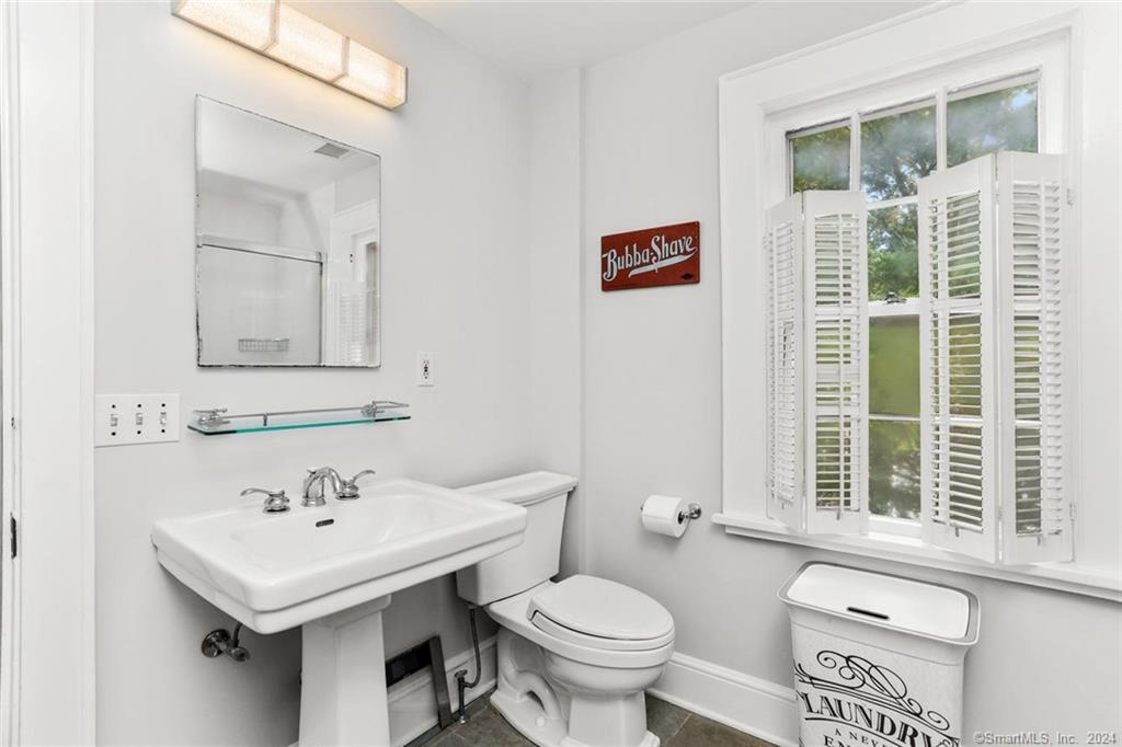 61 Hillandale Road Westport, CT 06880 - Photo 23 of 40 a bathroom with a sink and a toilet