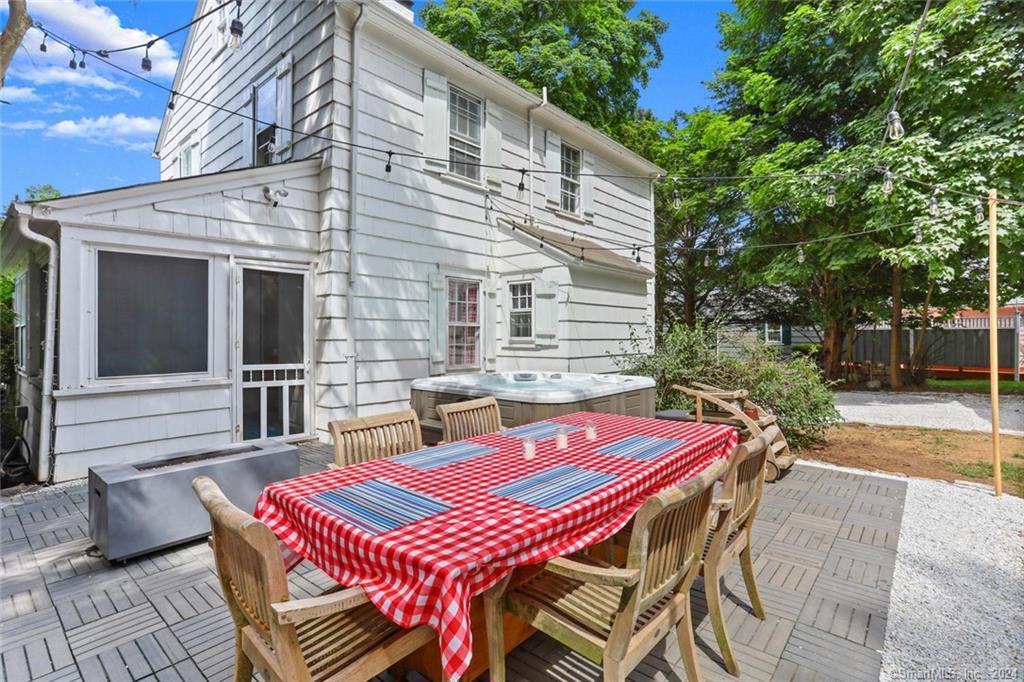61 Hillandale Road Westport, CT 06880 - Photo 26 of 40 a patio with a table and chairs and potted plants