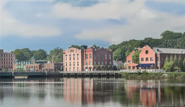 a kitchen with a stove and a chandelier