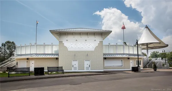 a view of a swimming pool and an outdoor seating