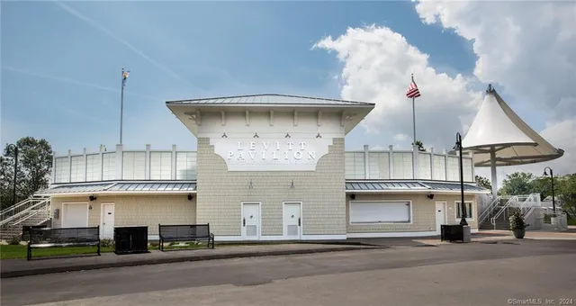 a view of a swimming pool and an outdoor seating