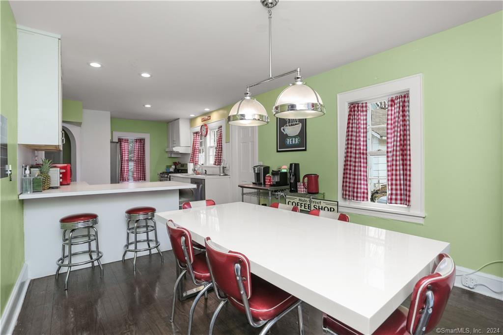61 Hillandale Road Westport, CT 06880 - Photo 10 of 40 a view of a dining room with furniture window and wooden floor