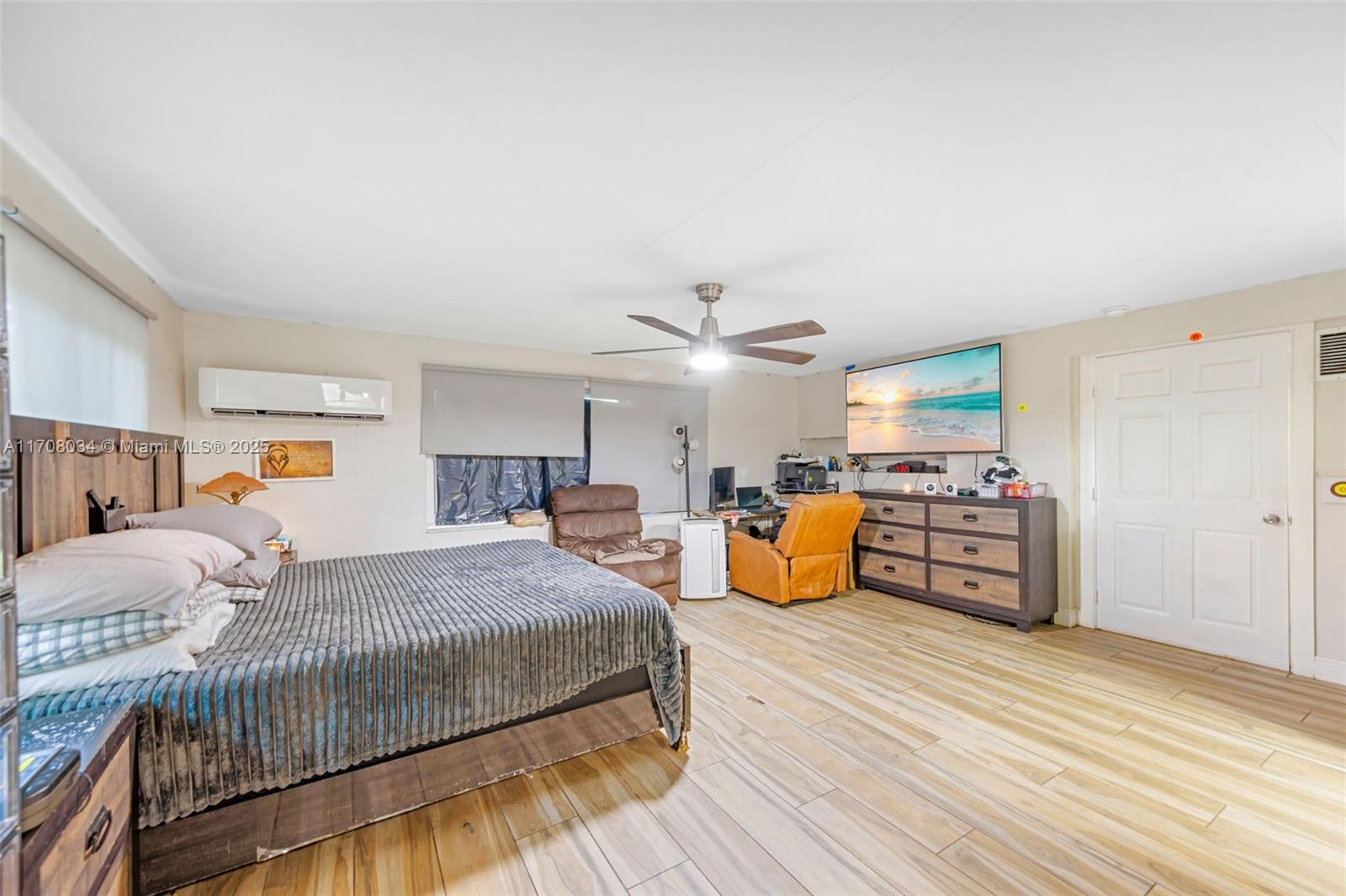 5737 Greene Street Hollywood, FL 33021 - Photo 16 of 19 a bedroom with furniture and a wooden floor