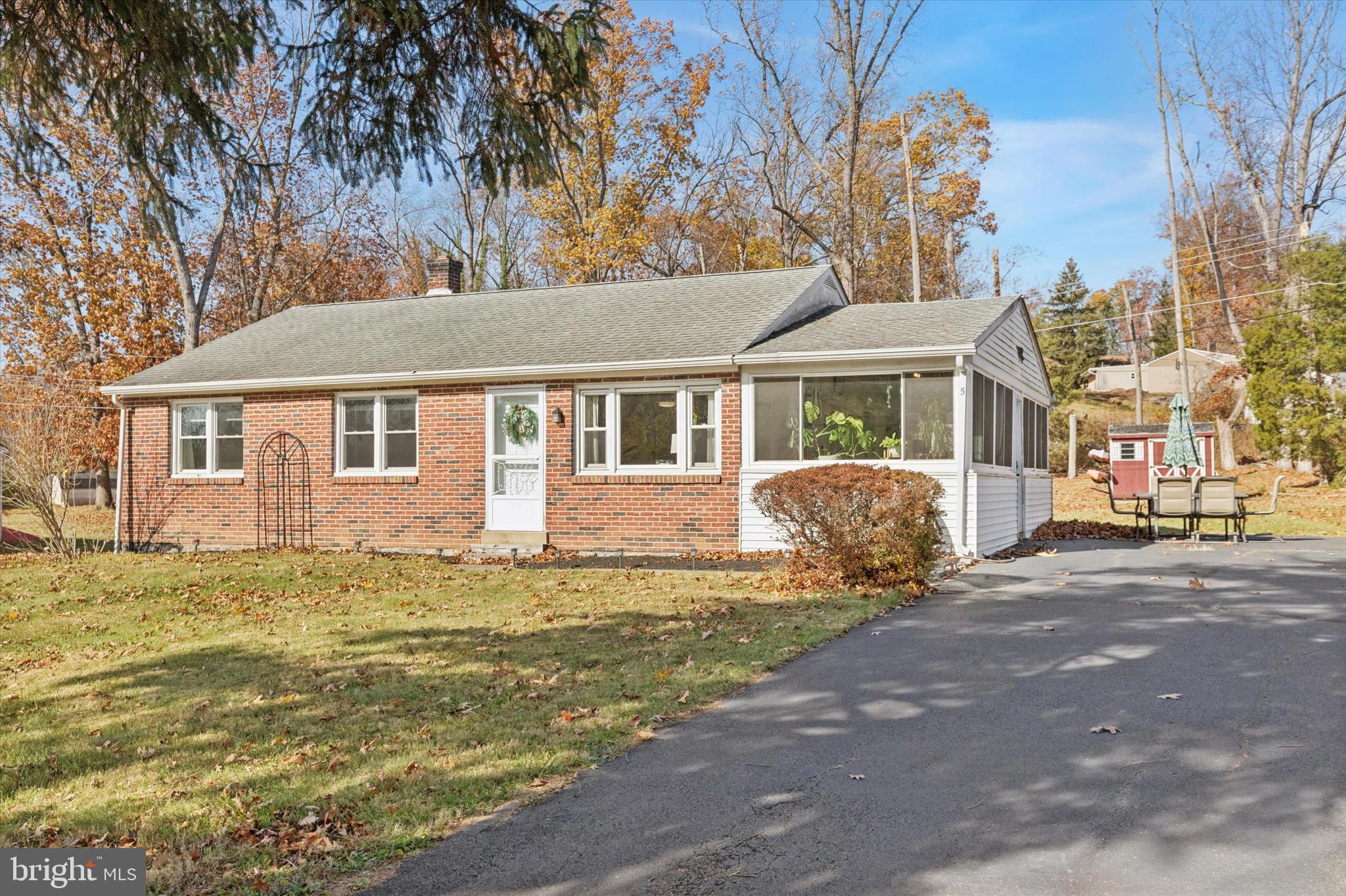5 Mary Jane Street Spring Mount, PA 19473 - Photo 2 of 25 a front view of a house with a garden