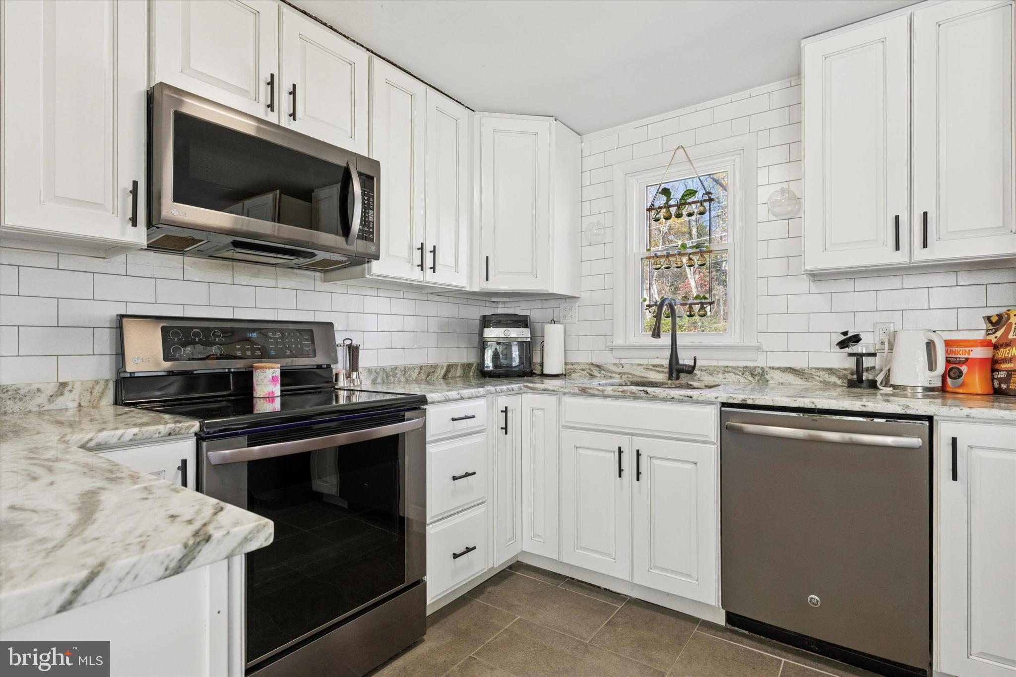 5 Mary Jane Street Spring Mount, PA 19473 - Photo 6 of 25 a kitchen with cabinets stainless steel appliances a sink and a counter space