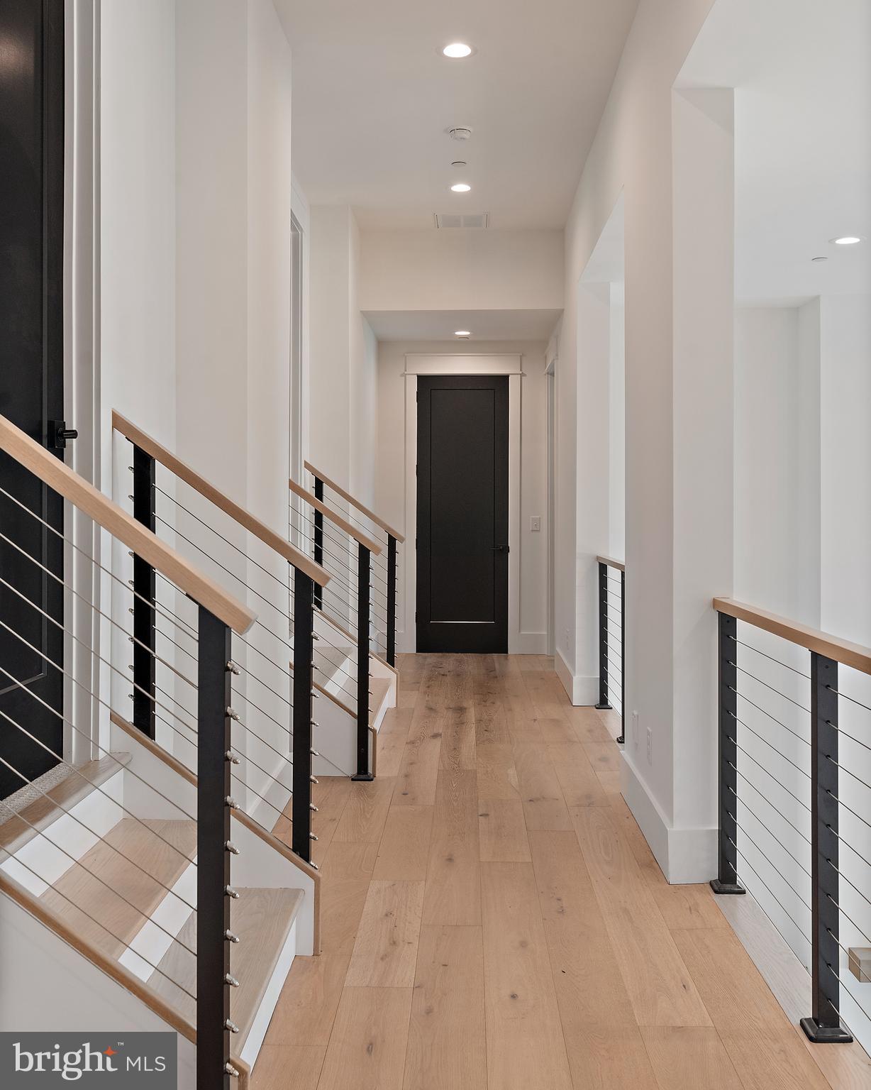 2452 Bennett Point Road Queenstown, MD 21658 - Photo 63 of 108 Upper Level Hall with custom cable railings