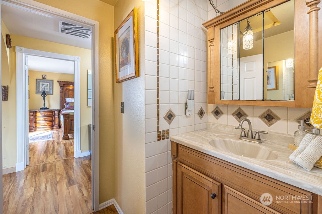 22422 4th Avenue Southeast Bothell, WA 98021 - Photo 11 of 39 a bathroom with a sink a mirror and shower