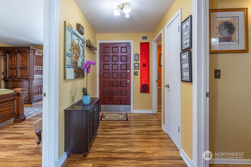 22422 4th Avenue Southeast Bothell, WA 98021 - Photo 12 of 39 a view of a hallway with wooden floor and windows