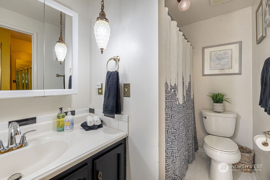 22422 4th Avenue Southeast Bothell, WA 98021 - Photo 16 of 39 a bathroom with a sink a toilet and a mirror