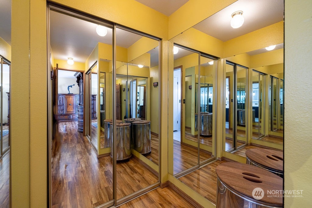 22422 4th Avenue Southeast Bothell, WA 98021 - Photo 18 of 39 a bathroom with a glass shower door and a wooden floor