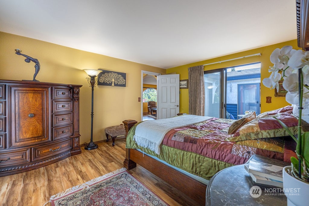 22422 4th Avenue Southeast Bothell, WA 98021 - Photo 19 of 39 a bedroom with a bed and a mirror on the dresser