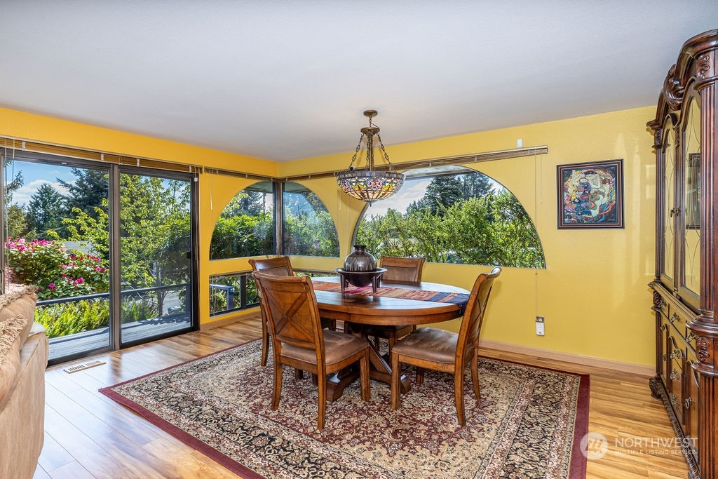 22422 4th Avenue Southeast Bothell, WA 98021 - Photo 21 of 39 a view of a dining room with furniture and wooden floor