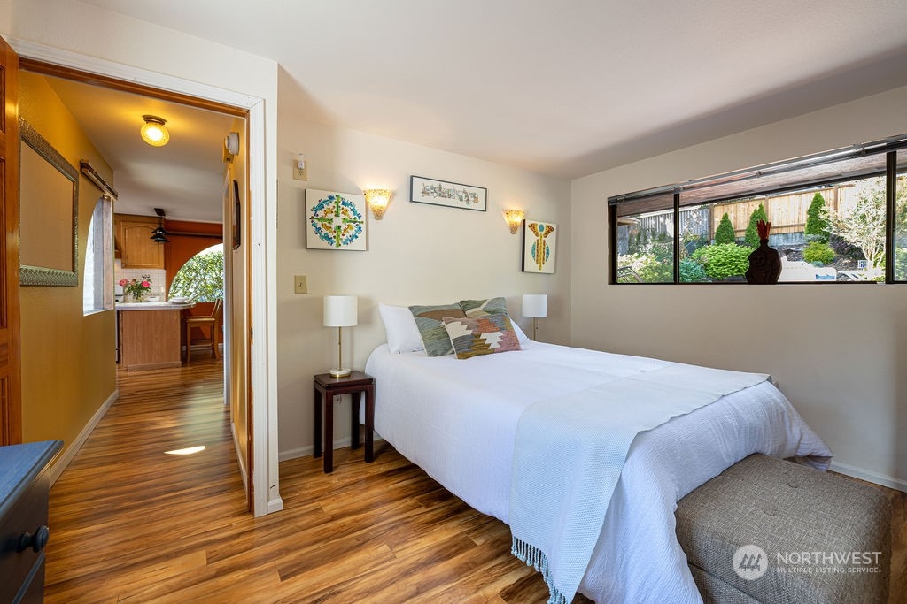 22422 4th Avenue Southeast Bothell, WA 98021 - Photo 28 of 39 a bedroom with a bed and wooden floor