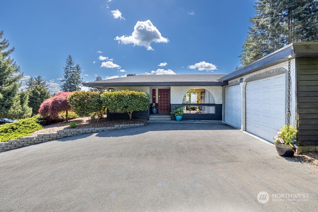 22422 4th Avenue Southeast Bothell, WA 98021 - Photo 3 of 39 a house view with a garden space