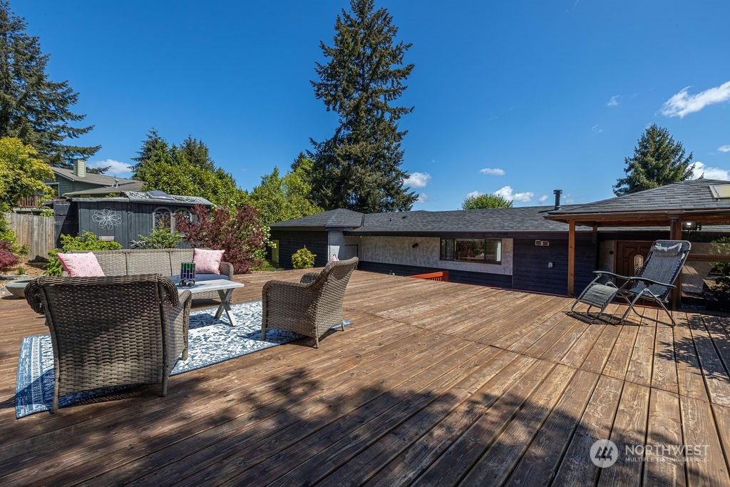 22422 4th Avenue Southeast Bothell, WA 98021 - Photo 35 of 39 a front view of house with yard outdoor seating and covered with trees