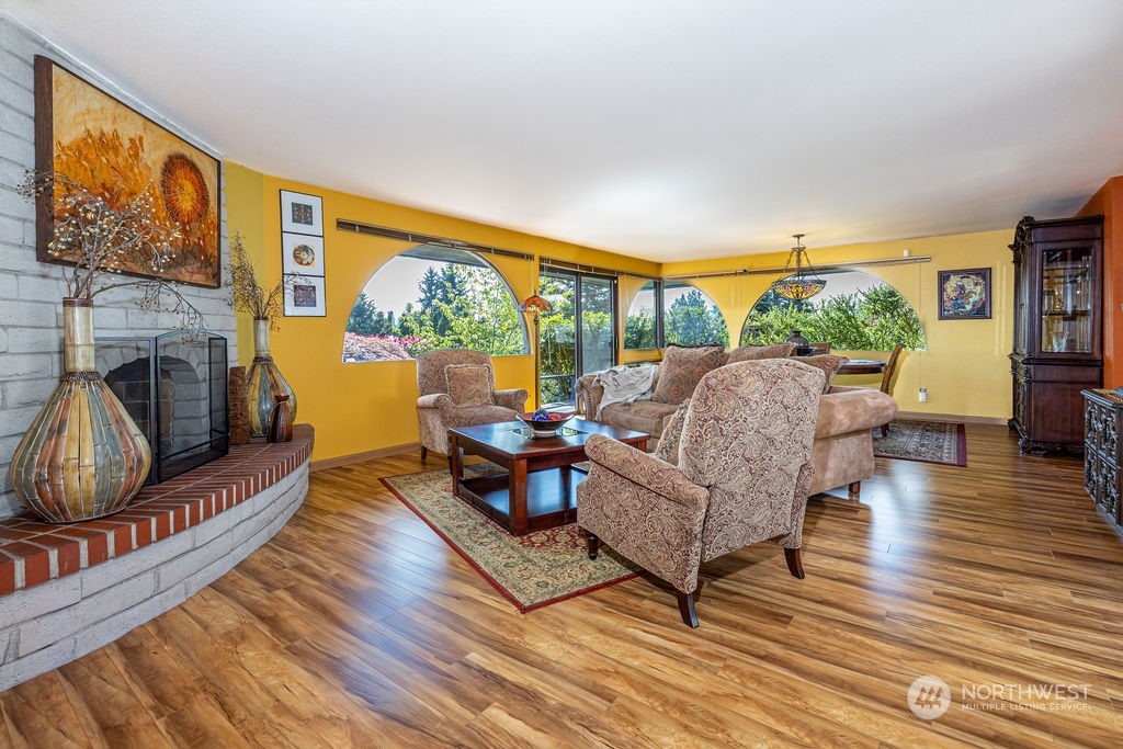22422 4th Avenue Southeast Bothell, WA 98021 - Photo 9 of 39 a living room with furniture a flat screen tv and a floor to ceiling window