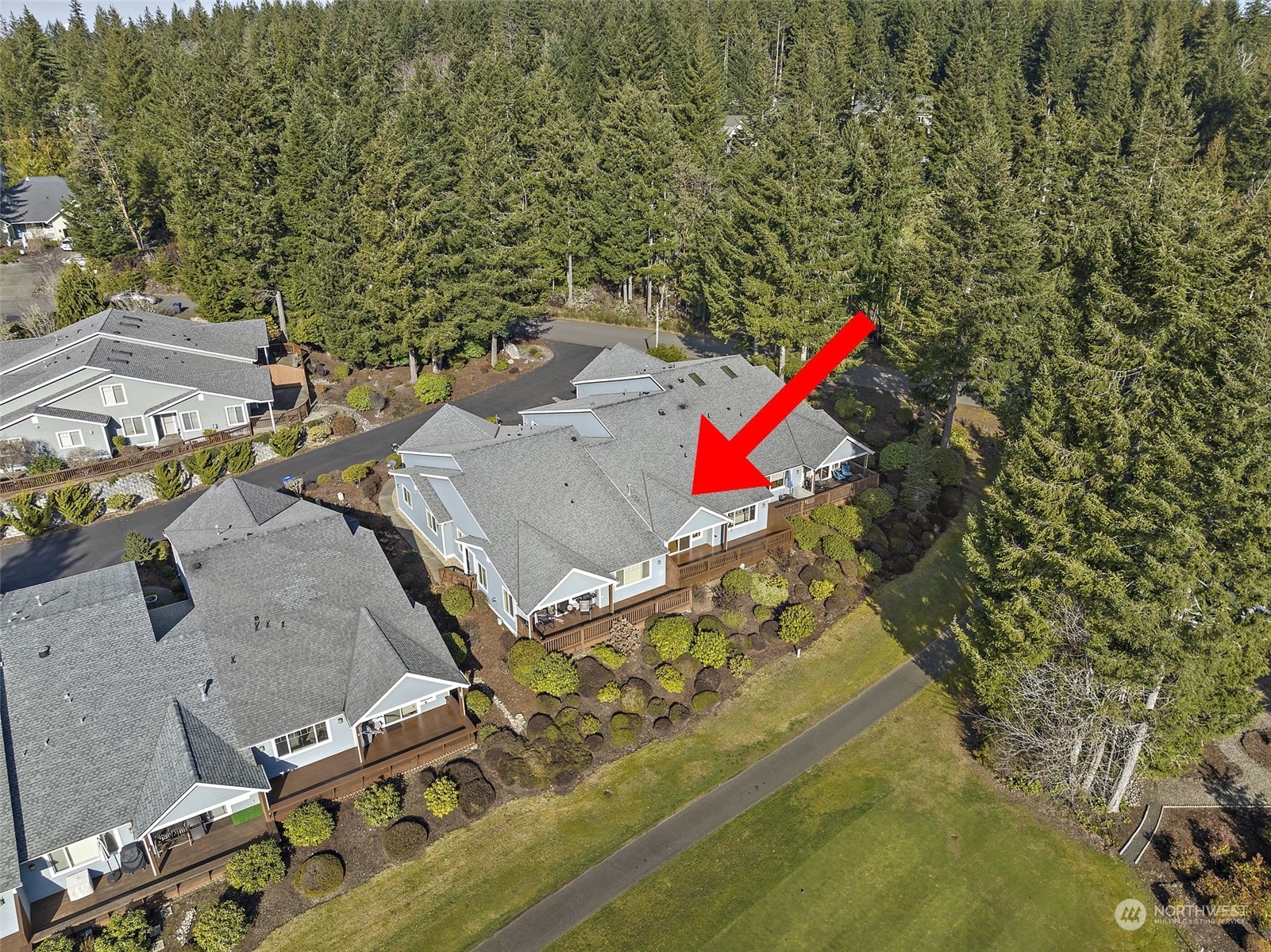91 East Soderberg Road, Unit A2 Allyn, WA 98524 - Photo 27 of 32 an aerial view of a house with a yard