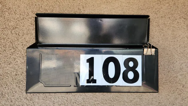 a view of outdoor area with a door and a sign on it