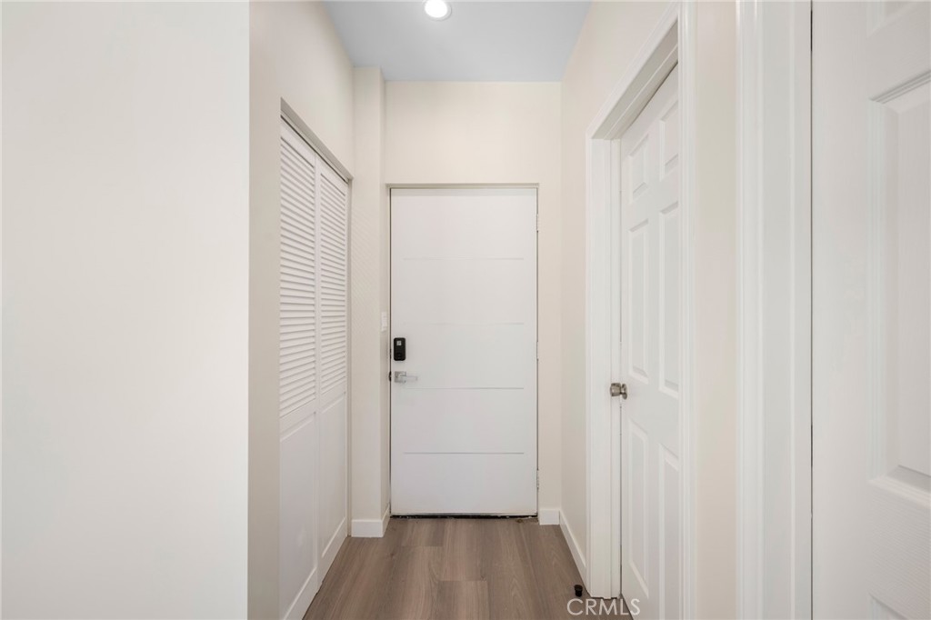 8435 Rincon Avenue Sun Valley, CA 91352 - Photo 38 of 61 a view of a hallway with wooden floor