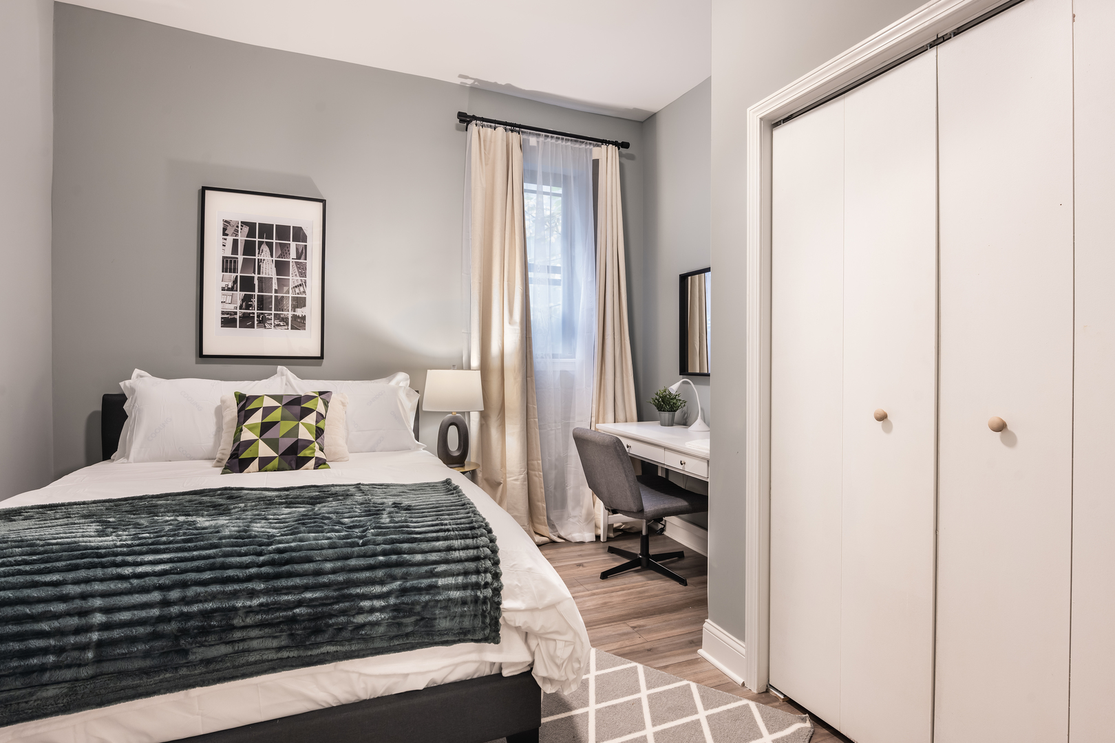 5017 South Drexel Boulevard, Unit 101 Chicago, IL 60615 - Photo 8 of 12 a bedroom with a bed and a window