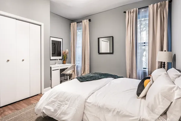 a bedroom with a bed and a view of bedroom