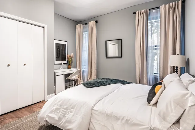 a bedroom with a bed and a view of bedroom