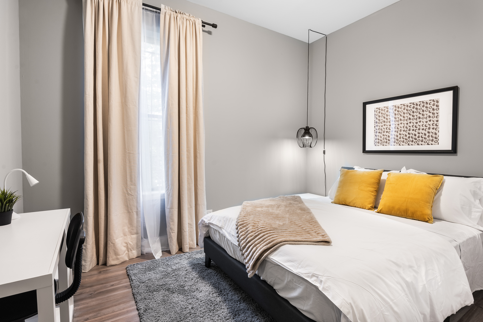 5017 South Drexel Boulevard, Unit 101 Chicago, IL 60615 - Photo 10 of 12 a bedroom with a bed and a window