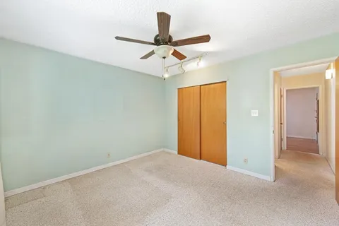 a view of a chandelier fan in a room