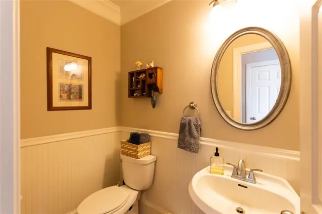 a living room with furniture a flat screen tv and a large window