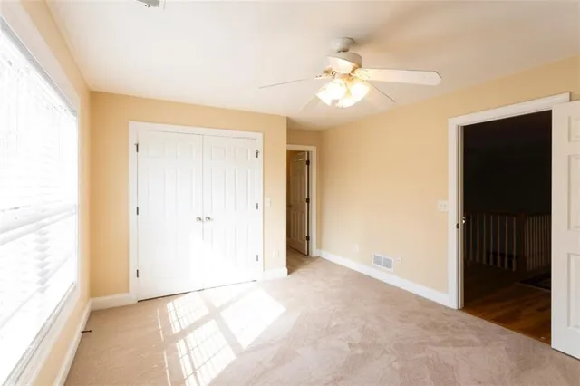a view of a patio with table and chairs and potted plants