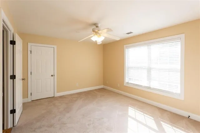 a view of a dining room with furniture a chandelier and wooden floor